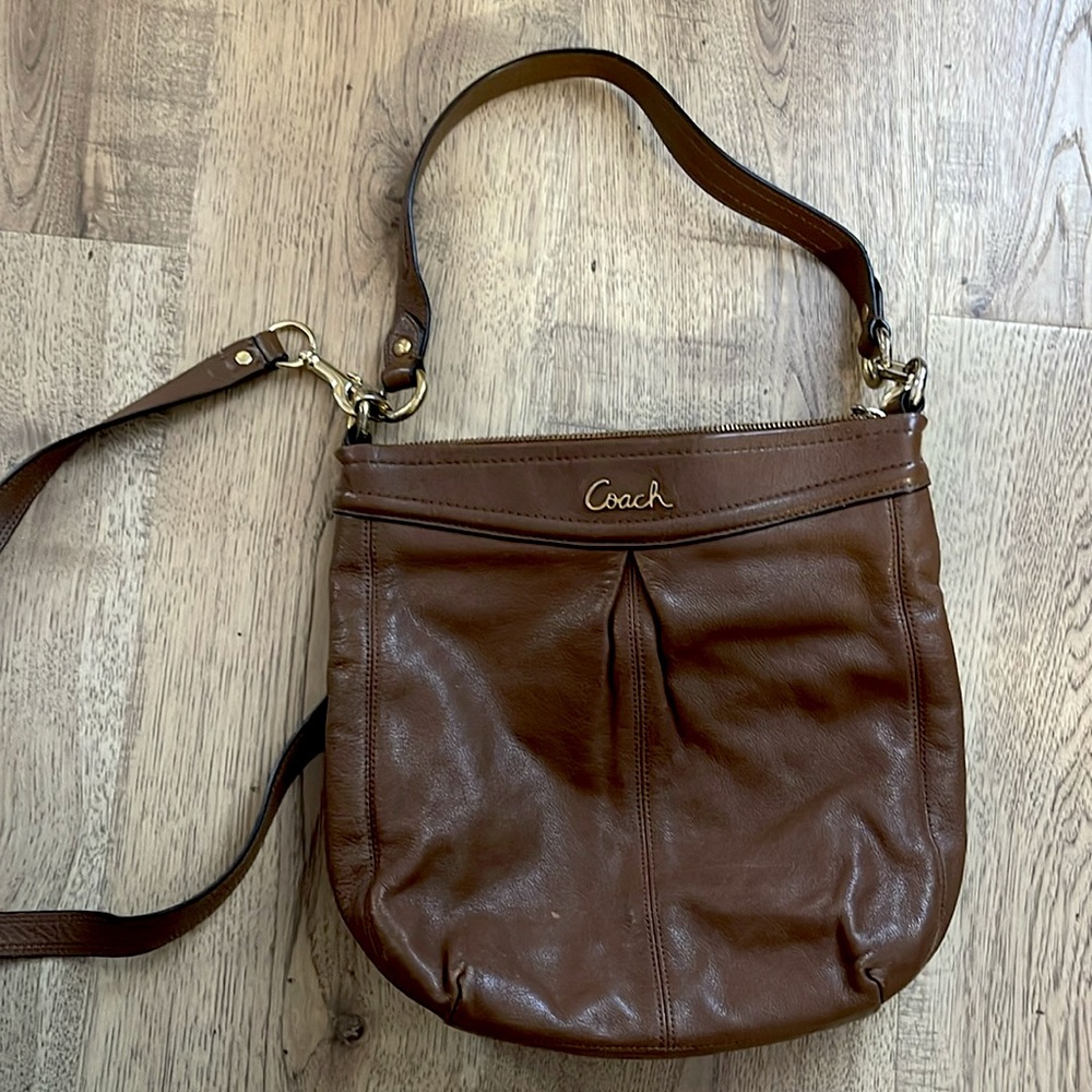 Brown coach purse. Some wear and tear but makes the perfect cross body bag.